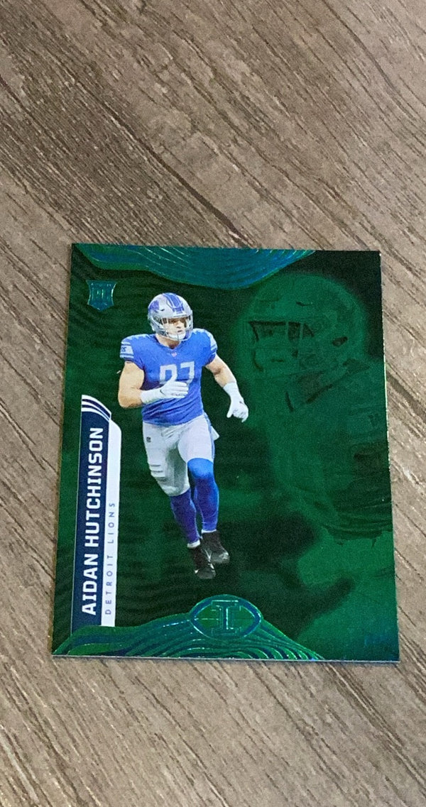 Aidan Hutchinson 2022 Panini Illusions - Trophy Collection Emerald 29 trading card image front