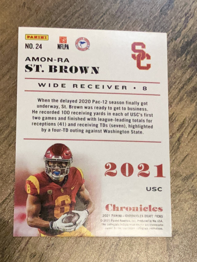 Amon-Ra St. Brown USC Trojans NFL 2021 Panini Chronicles Draft Picks - Purple 24 SN49 Panini